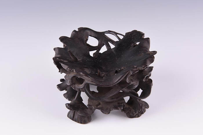 Carved ebony lotus base